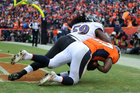 Knowshon Moreno of the Broncos makes catch for a touchdown in the second quarter against the Ravens' Dannell Ellerbe.