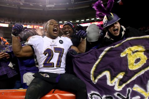 Ray Rice celebrates with some of the Ravens fans in Denver after Saturday's win.