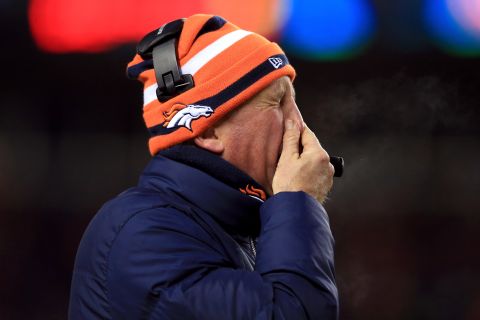 Denver head coach John Fox grimaces during Saturday's AFC Divisional Playoff game.