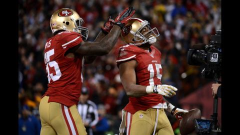 Tight end Vernon Davis celebrates with Crabtree of after scoring a touchdown for the 49ers in the second quarter.