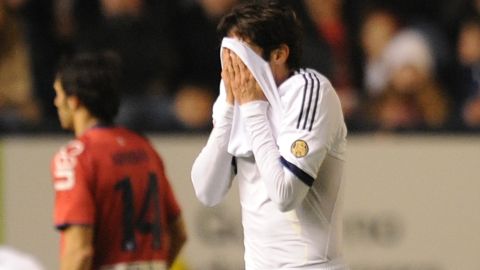 Kaka hides his face after being shown the red card during Real Madrid's 0-0 draw in Pamplona on January 12.