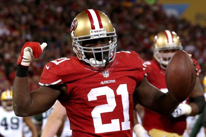 Running back Frank Gore of the San Francisco 49ers celebrates after scoring a touchdown in the fourth quarter against the Green Bay Packers during an NFC Divisional Playoff game at Candlestick Park in San Francisco on Saturday, January 12.