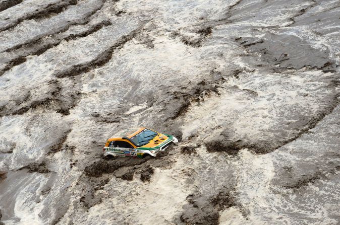 Brazil's Guilherme Spinelli gets stuck in a flooded river during the eighth stage of the rally on January 12.