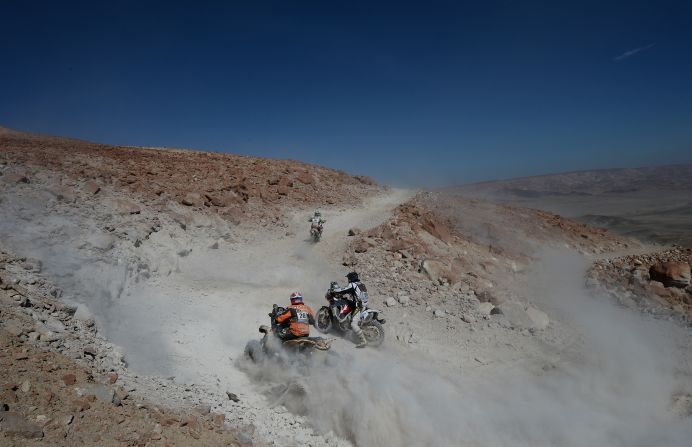 Unidentified bikers and ATV riders compete during Stage 4 between Nazca and Arequipa, Peru, on Tuesday, January 8. 