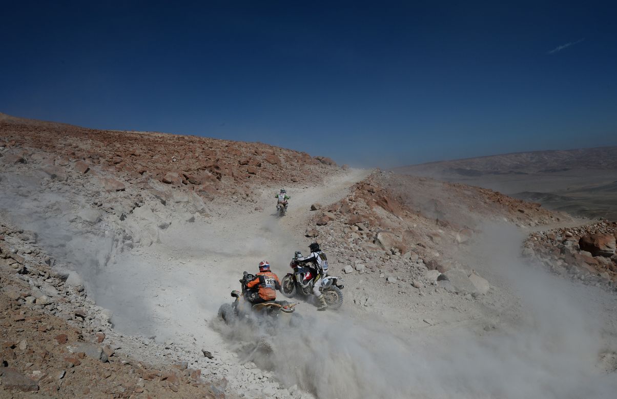 Unidentified bikers and ATV riders compete during Stage 4 between Nazca and Arequipa, Peru, on Tuesday, January 8. 