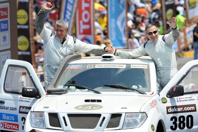 France's Jean-Marc Verrier, left, and Herve Toscano wave to the crowd  in their Chevrolet Springbok prototype during the 2013 Dakar Rally departure ceremony in Lima on January 5.