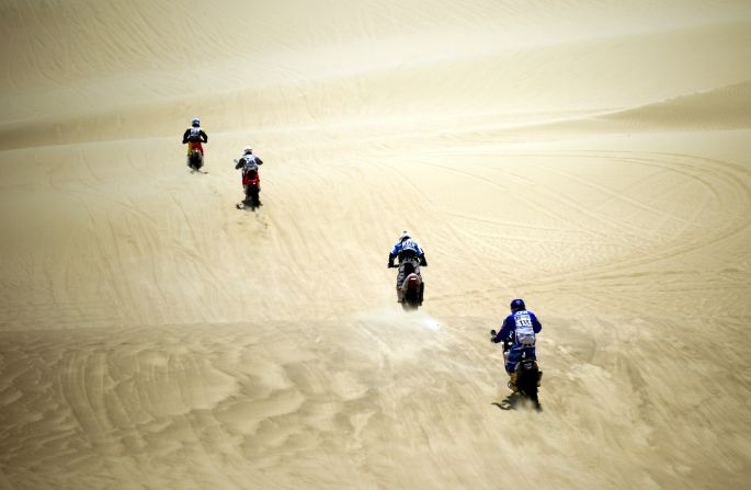 Riders compete during Stage 1 between Lima and Pisco, Peru, on Saturday, January 5.