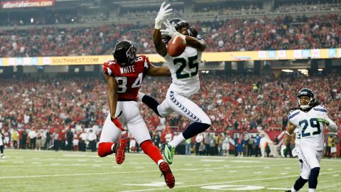 Richard Sherman of the Seahawks breaks up a pass intended for Roddy White of the Falcons on Sunday.
