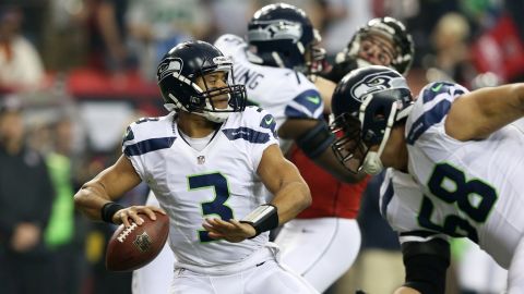 Seahawks quarterback Russell Wilson looks to pass against the Falcons in the first quarter on Sunday.
