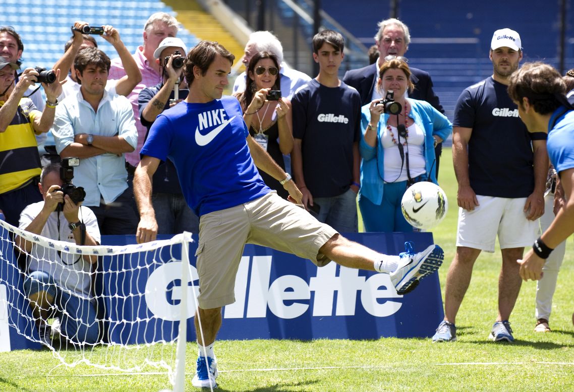Federer controls the ball during a soccer-tennis exhibition match with Argentinian Juan Martin Del Potro and former footballer Gabriel Batistuta (both out of picture) at the Bombonera stadium in Buenos Aires.