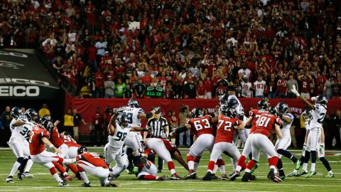 Matt Bryant of the Atlanta Falcons kicks the game-winning field goal in the fourth quarter against the Seattle Seahawks during the NFC divisional playoff Game at Georgia Dome on Sunday, January 13, in Atlanta.