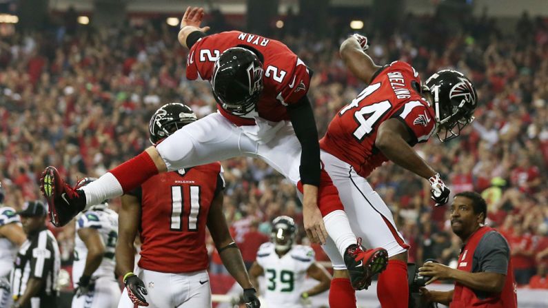 Matt Ryan and Jason Snelling of the Falcons celebrate a touchdown against the Seahawks on Sunday.