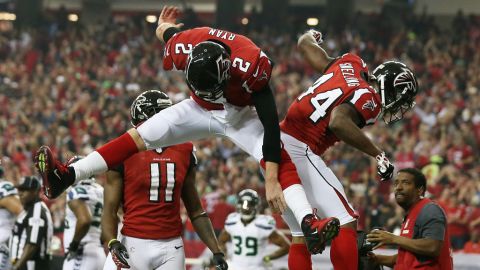 Matt Ryan and Jason Snelling of the Falcons celebrate a touchdown against the Seahawks on Sunday.