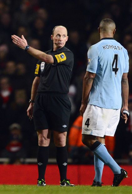 City also went down to 10 men in the second half when captain Vincent Kompany (R) was shown a red card by referee Mike Dean for his sliding tackle on Arsenal midfielder Jack Wilshere.