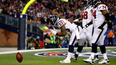 Arian Foster of the Texans celebrates after scoring a touchdown in the second quarter against the Patriots on Sunday.