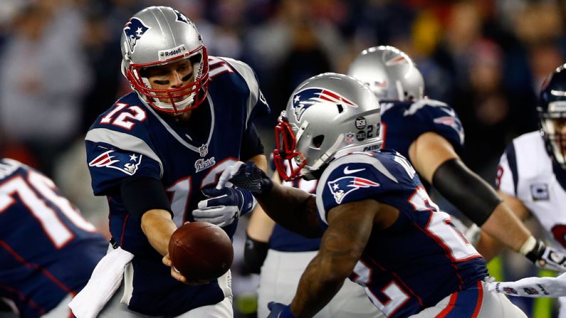 Tom Brady of the Patriots hands the ball off to Stevan Ridley on Sunday.