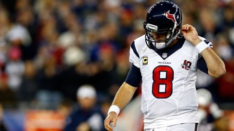 Matt Schaub of the Texans walks off the field after failing to convert on third down against the Patriots on Sunday.