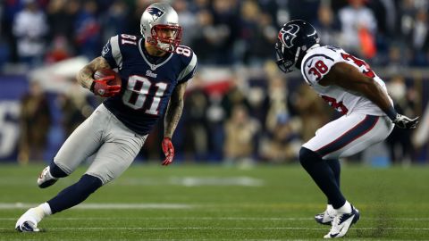 Aaron Hernandez of the New England Patriots runs the ball against Danieal Manning of the Houston Texans.