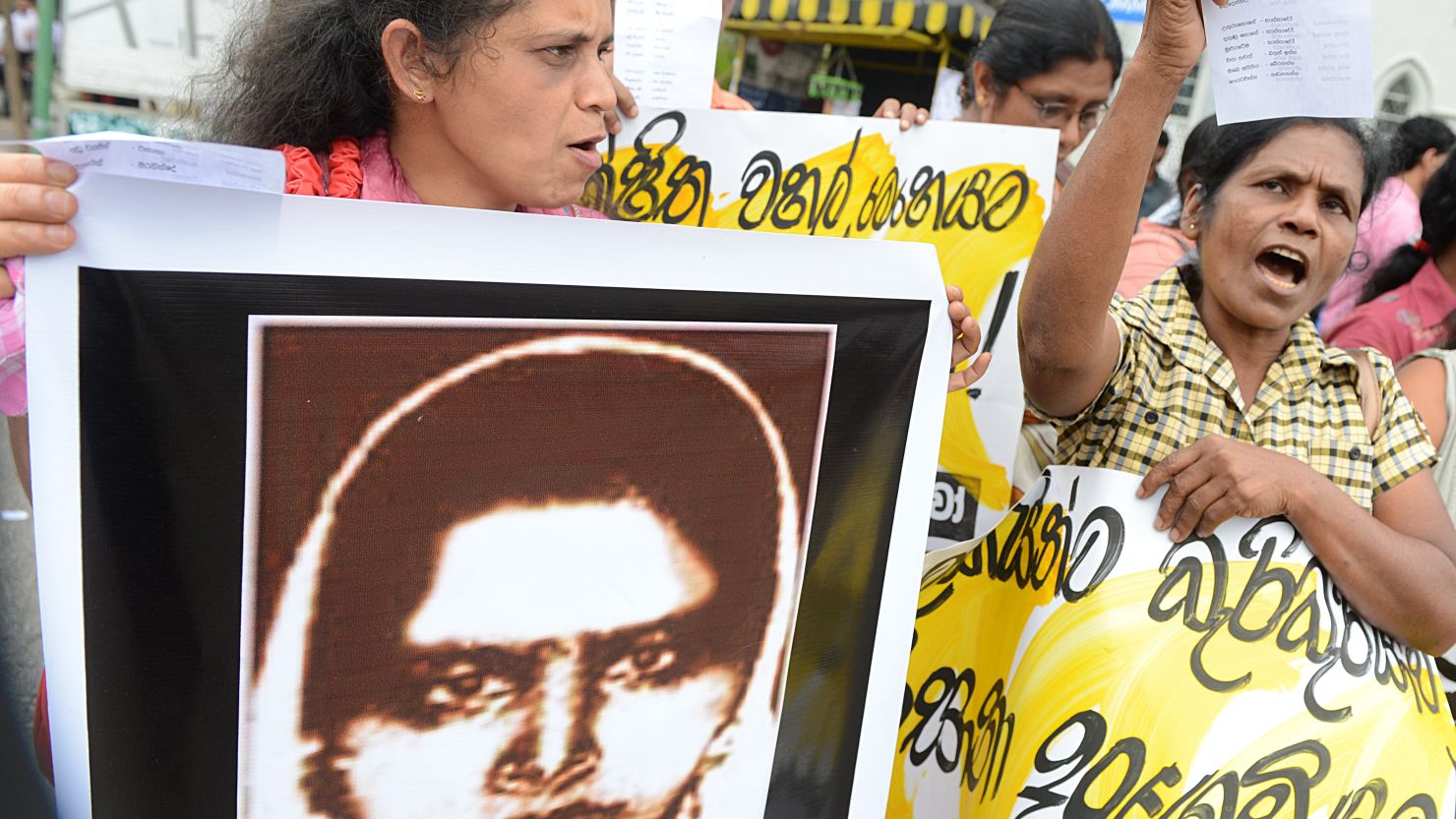 Activists hold up a portrait of Rizana Nafeek, following her execution by Saudi authorities, Colombo, January 11, 2013.