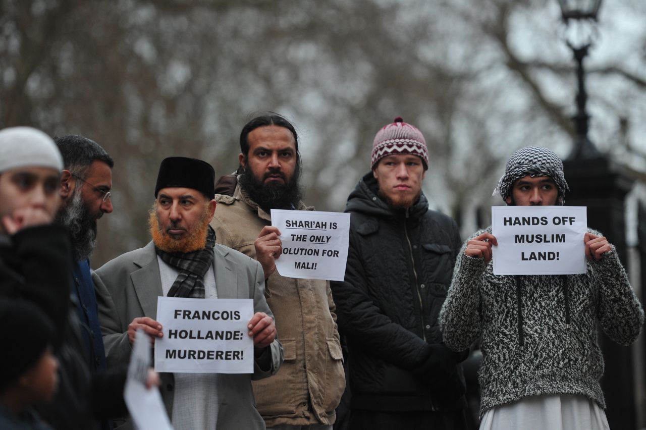 Muslim men protest French military action in Mali outside the French Embassy in central London on Saturday, January 12. About 50 Muslim protesters gathered outside the embassy.