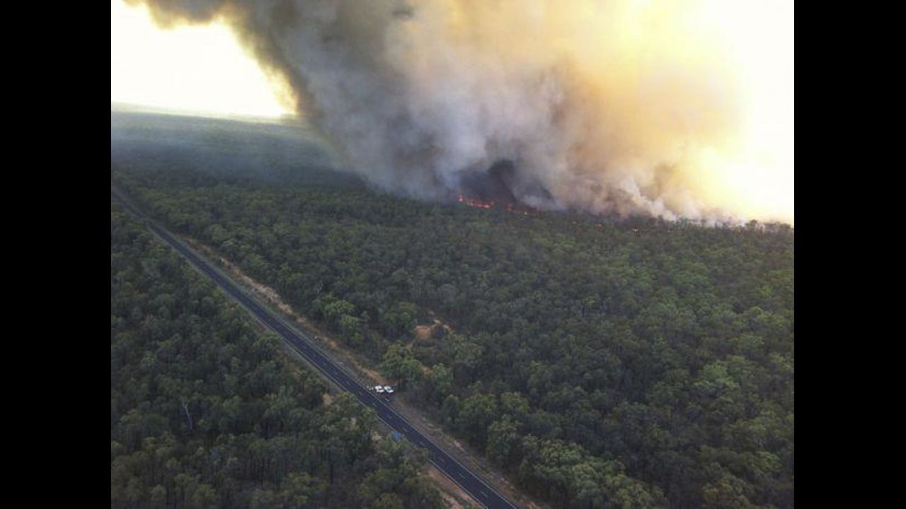 The Redbank North Fire burns close to the Newell Highway near Coonabarabran on Monday.