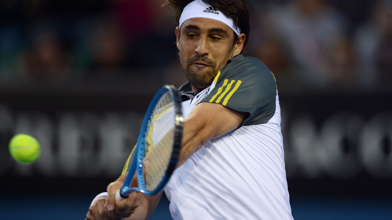 Cyprus's Marcos Baghdatis hits a return against Spain's Albert Ramos on January 14. Baghdatis won 6-7(0) 7-6(4) 6-4 3-6 6-3.