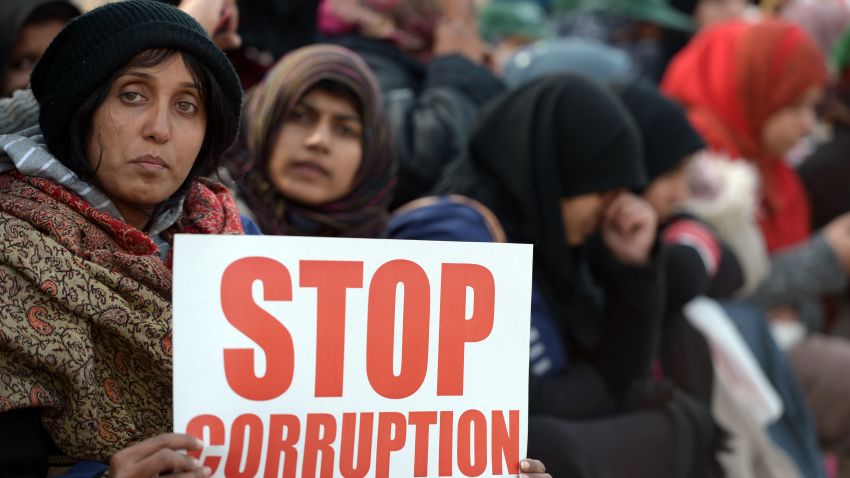 Pakistani supporters of Canadian-Pakistani cleric Tahir-ul Qadri hold placards during a protest march in Islamabad on January 15, 2013.