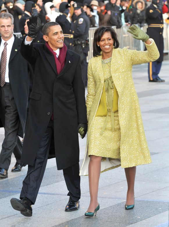 President Barack Obama and first lady Michelle Obama wave to the crowd at the 2009 inaugural parade.