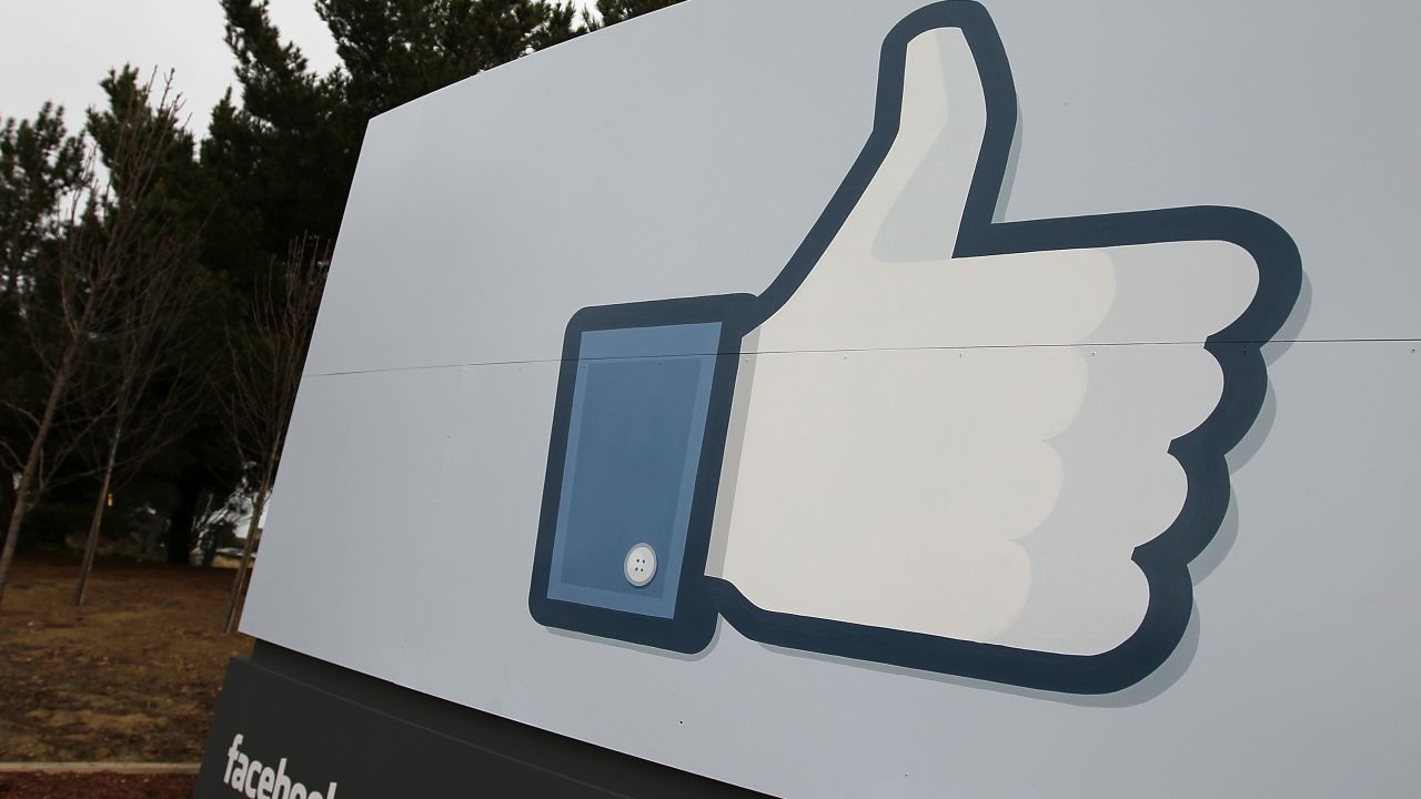 A sign with the 'like' symbol stands in front of the Facebook headquarters on February 1, 2012 in Menlo Park, California.