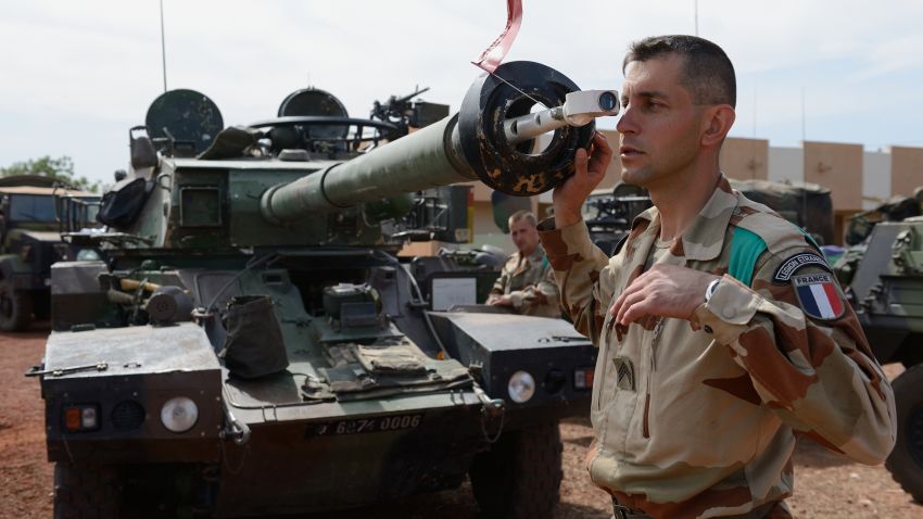 French army Legionnaire from the Licorne force based in Abidjan (Ivory Coast) checks the canon of a Sagai tank on January 15, 2013 at the 101 military airbase near Bamako, before leaving as part of France's 'Serval' operation in the Islamists occupyed northern Mali.