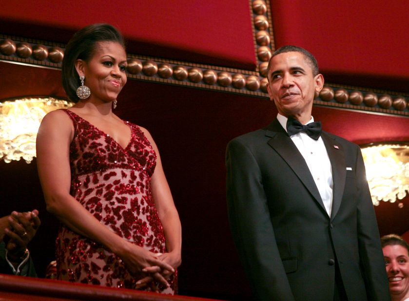 Obama highlighted Naeem Khan's talents in a scarlet-hued gown with matte crushed sequins and abstract wind-blown roses on scarlet tulle at the 2010 Kennedy Center Honors, according to Taylor.