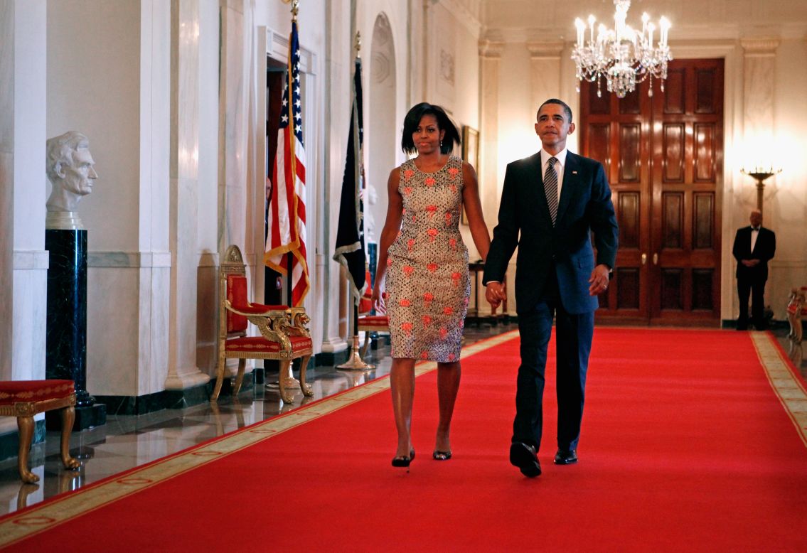 The first lady made an entrance at the 2011 Medal of Honor ceremony in a brocade dress by Barbara Tfank that she has worn on multiple occasions since, Taylor said.