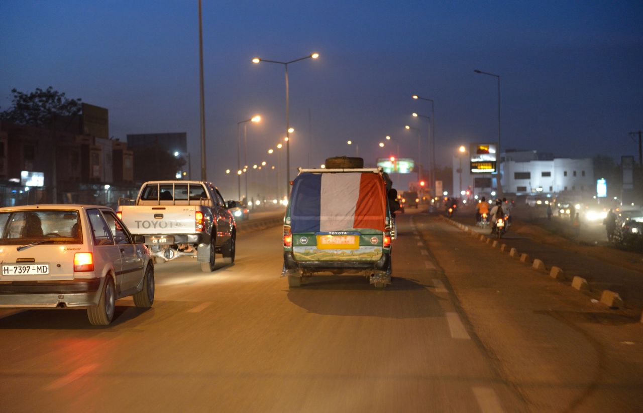 A French flag is hung on a van in Bamako as French troops start a deployment in the north of Mali on Wednesday. 