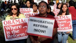  	Immigration-rights activists stage a rally calling for the government to act on immigration legislation, outside the venue of President Barack Obama's Democratic Congressional Campaign Committee fundraiser in Los Angeles on August 16, 2010. President Barack Obama recently signed a bill that tightens security at the Mexico border, hoping to address the hot issue of illegal immigration in the run-up to November congressional elections. The 600-million-dollar legislation hikes visa fees for some IT workers entering the United States, and has had been slammed by Indian industry. The fee increases pay for 1,000 new US Border Patrol agents to form a 'strike force' for quick deployment, 250 new Immigration and Customs Enforcement agents as well as 250 new Customs and Border Protection officers at ports of entry. It also boosts communications among law-enforcement officials. AFP PHOTO / Mark RALSTON (Photo credit should read MARK RALSTON/AFP/Getty Images)
