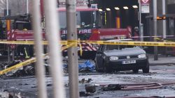 Debris and a burntout car are pictured at the scene of a helicopter crash in central London.