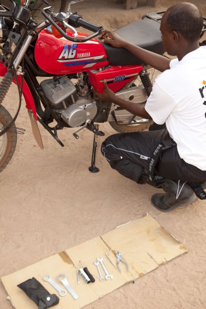 Jallow starts his day by carrying out a daily maintenance check on his motorbike to ensure it is working properly. RFH trains all health workers to conduct simple checks on their vehicles.