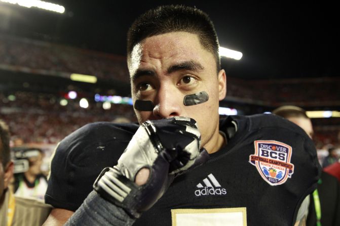The sports world and the Internet are abuzz as Notre Dame linebacker Manti Te'o says <a href="index.php?page=&url=http%3A%2F%2Fwww.cnn.com%2F2013%2F01%2F16%2Fsport%2Fmanti-teo-controversy%2Findex.html">he was the victim of a "sick joke"</a> that resulted in the creation of an inspirational story that had him overcoming the death of an online girlfriend at the same time he lost his grandmother. Here, Te'o leaves the field after a 42-14 loss against Alabama in the 2013 Discover BCS National Championship game on Monday, January 7, in Miami Gardens, Florida. See more photos of Te'o: