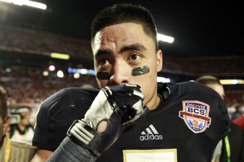 The sports world and the Internet are abuzz as Notre Dame linebacker Manti Te'o says <a href="http://www.cnn.com/2013/01/16/sport/manti-teo-controversy/index.html">he was the victim of a "sick joke"</a> that resulted in the creation of an inspirational story that had him overcoming the death of an online girlfriend at the same time he lost his grandmother. Here, Te'o leaves the field after a 42-14 loss against Alabama in the 2013 Discover BCS National Championship game on Monday, January 7, in Miami Gardens, Florida. See more photos of Te'o: