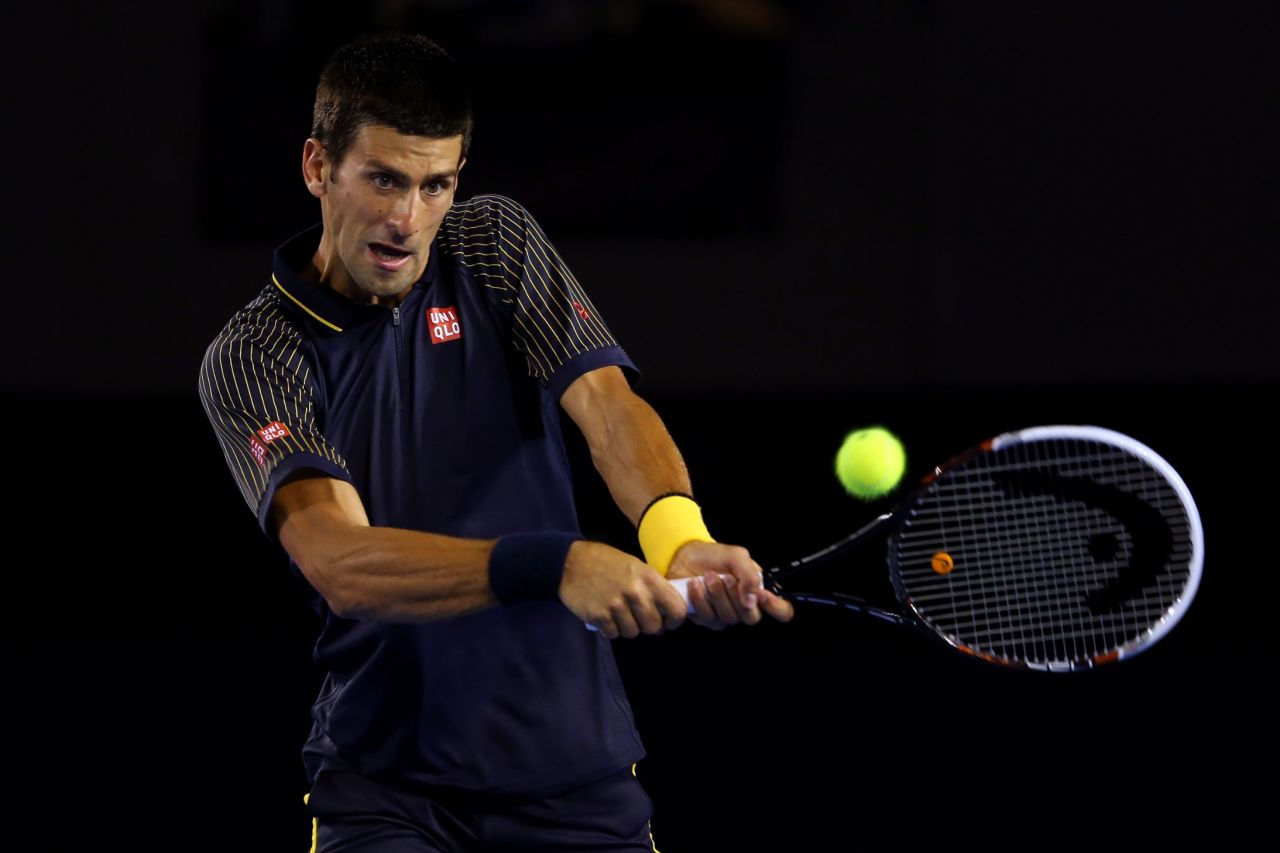 Novak Djokovic of Serbia plays a backhand in his second round match against Ryan Harrison of USA during on Wednesday, January 16. Djokovic defeated Harrison 6-1, 6-2, 6-3.