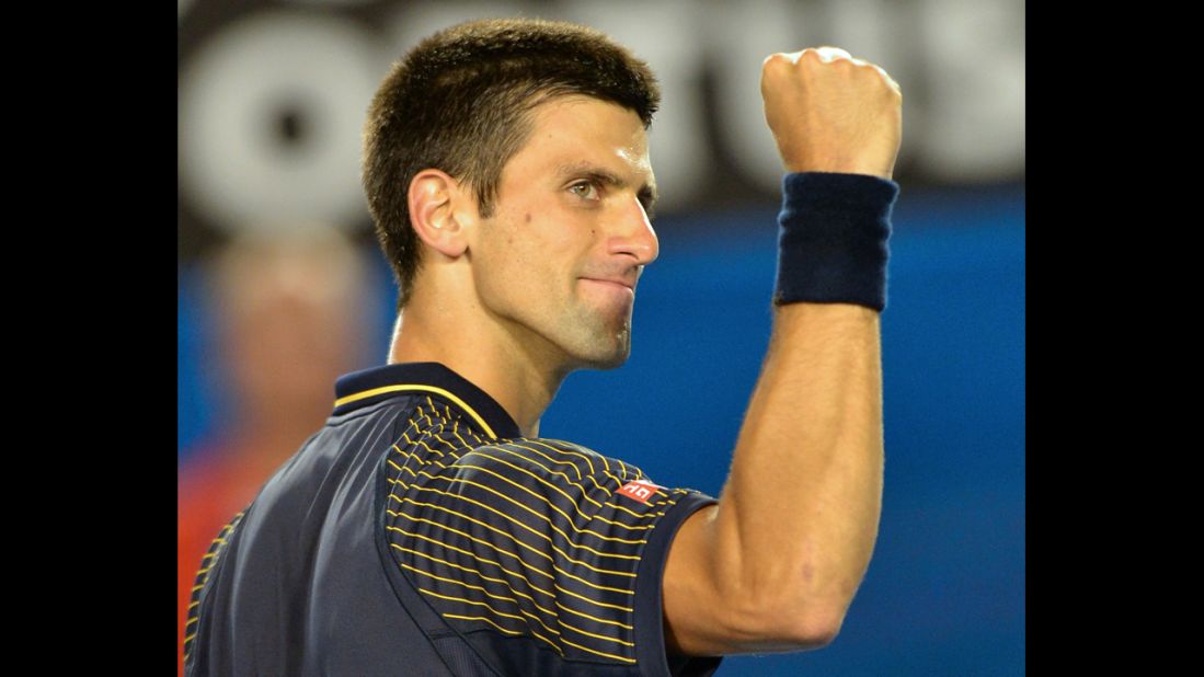 Djokovic gestures to the crowd as he celebrates victory over Harrison on January 16.