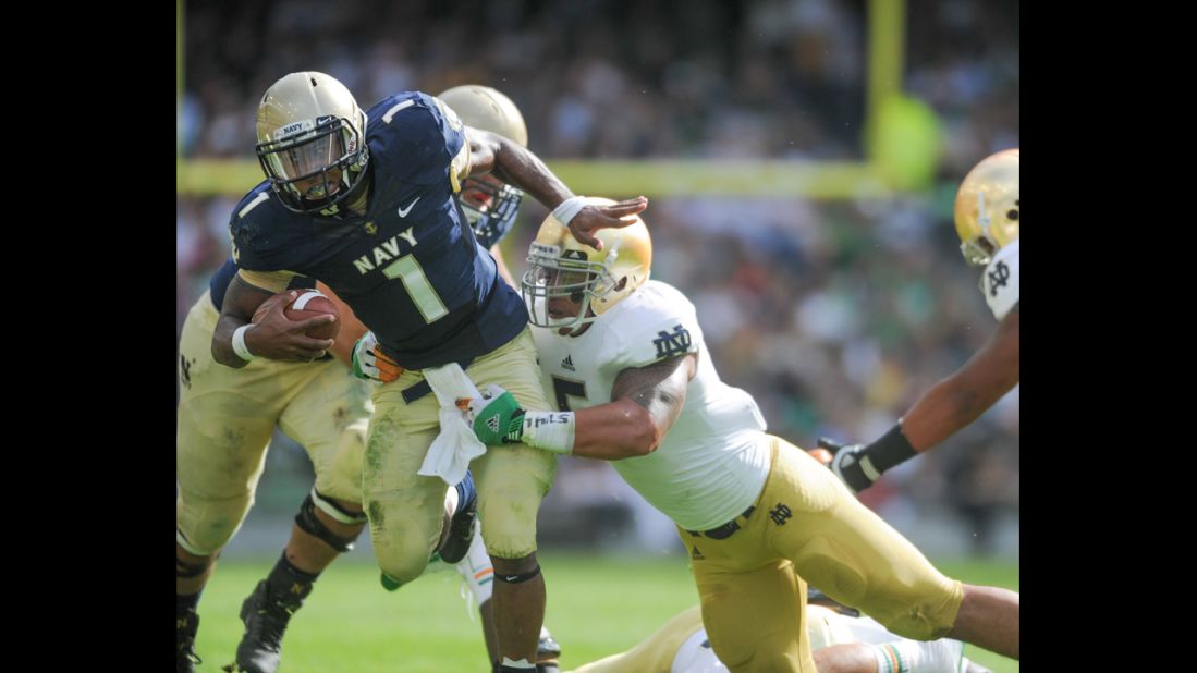 Te'o tackles Trey Miller of Navy during their game in Dublin, Ireland, on September 1, 2012.