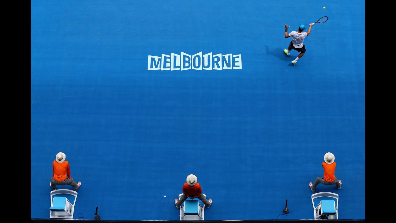 Bernard Tomic of Australia plays a forehand in his second-round match against Daniel Brands of Germany during Day Four of the 2013 Australian Open on January 17. Tomic narrowly defeated Brands 6-7 (4), 7-5, 7-6 (3), 7-6 (8).