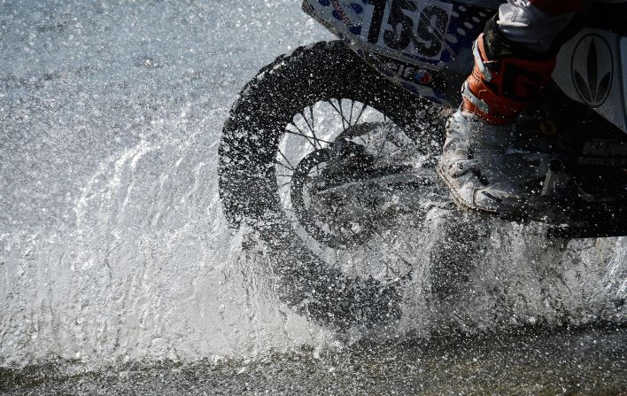 A biker splashes through Stage 10 on January 15.
