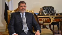 Egyptian president Mohamed Morsi poses prior a meeting with Iranian Foreign Minister in Cairo on January 10, 2013.