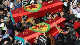 Thousands of Kurds carry the coffins of the three top Kurdish activists Sakine Cansiz, Fidan Dogan and Leyla Soylemez, shot dead in the French capital, on January 17 in Diyarbakir.