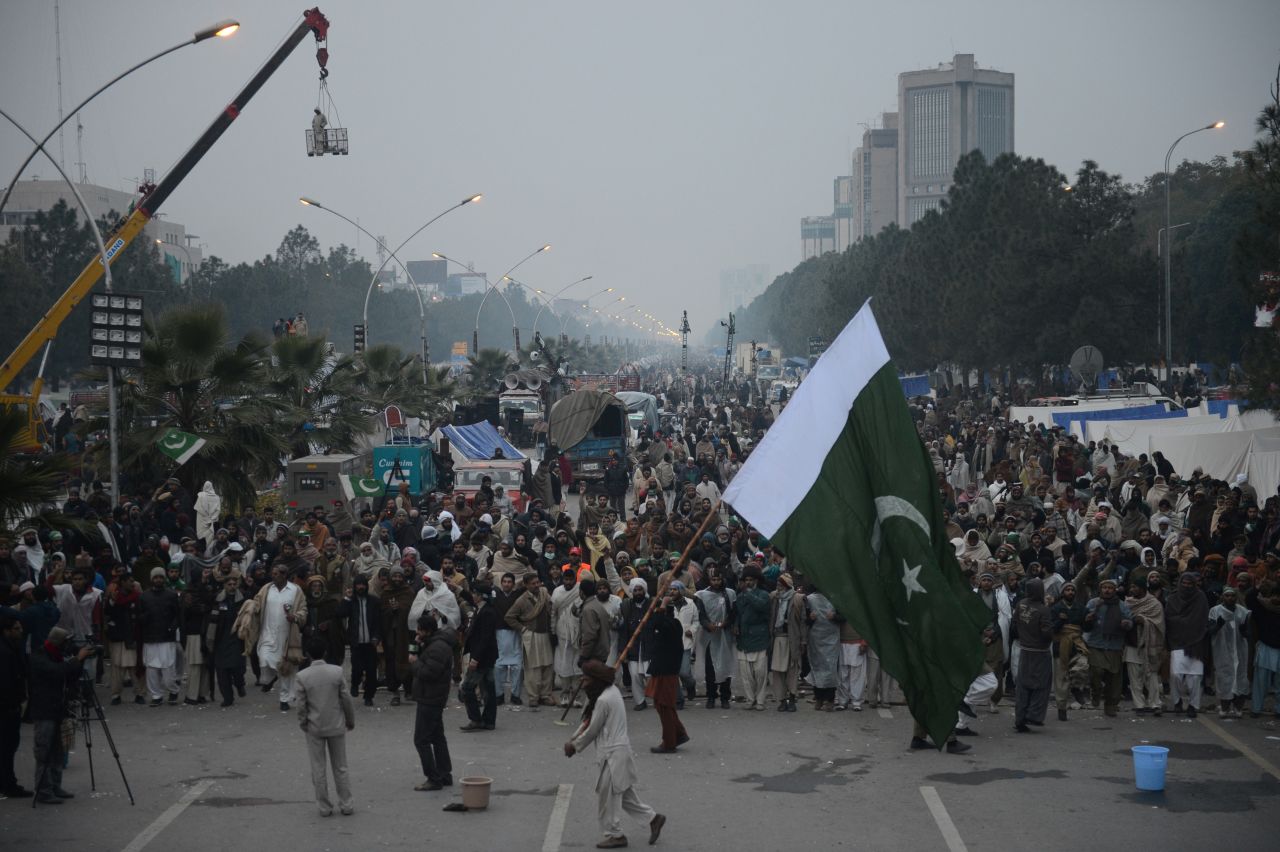 Supporters of Tahir-ul Qadri gather on the fourth day of protests in Islamabad early on January 17.