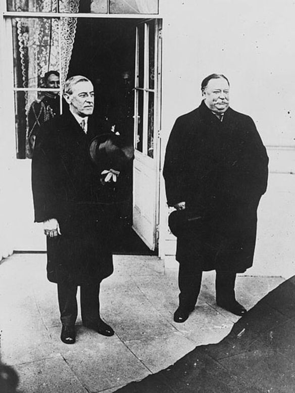 Top hats and overcoats were the appropriate garb for Woodrow Wilson's chilly 1913 inauguration. Here, Wilson, left, stands with outgoing President Howard Taft.