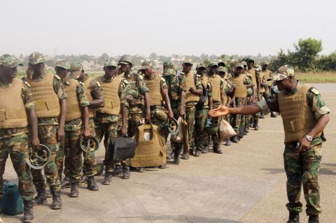 Togolese troops board a plane to Bamako, Mali, on Thursday, January 17, at the Lome airport in Togo. Troops from West African countries are heading to Mali as part of a U.N.-mandated African force to fight the insurgents. 