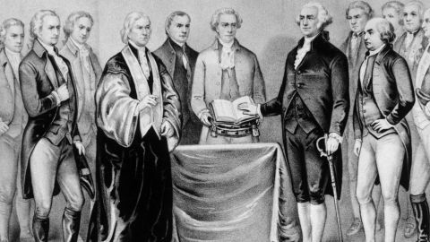 Sword by his side, George Washington takes his inaugural oath as the first President of the United States in 1788.