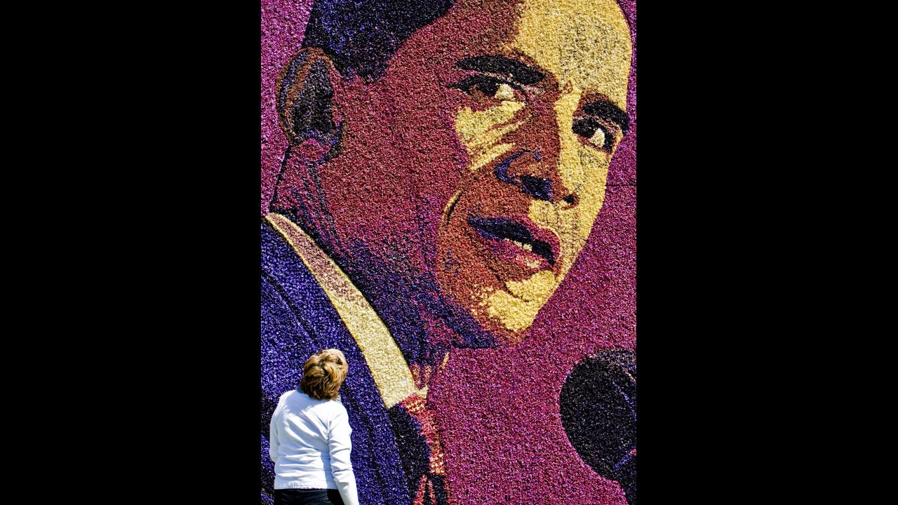 HOLLAND: A Dutch woman looks at a flower mosaic featuring Obama in Limmen, on May 12, 2009.